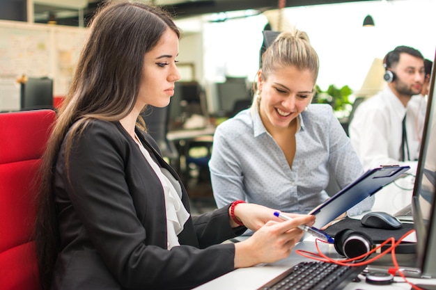 Two business women working in office