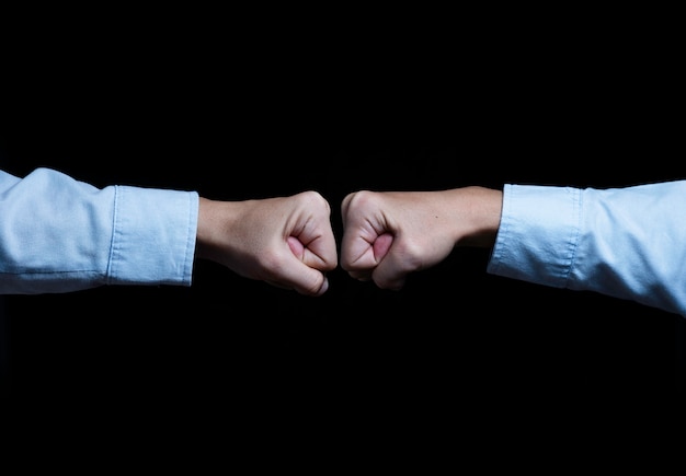 Two businessman hand fist boxing and fighting. Business competition concept.