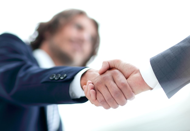 Two businessman shaking hands greeting each other