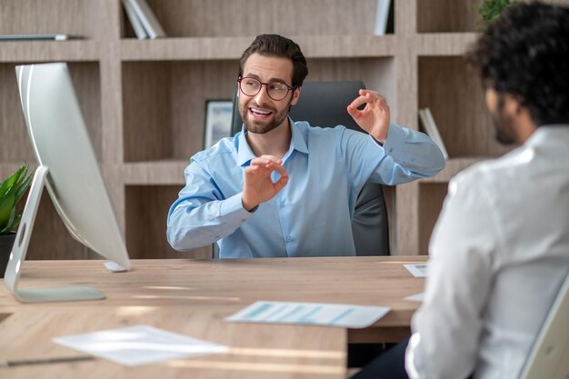 two businessmen discussing project details and looking involved