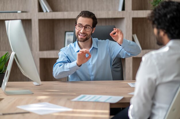 Two businessmen discussing project details and looking involved