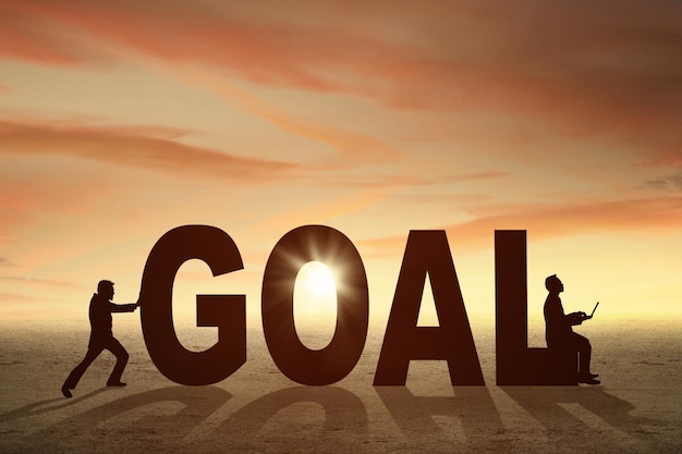 two businessmen and a goal word