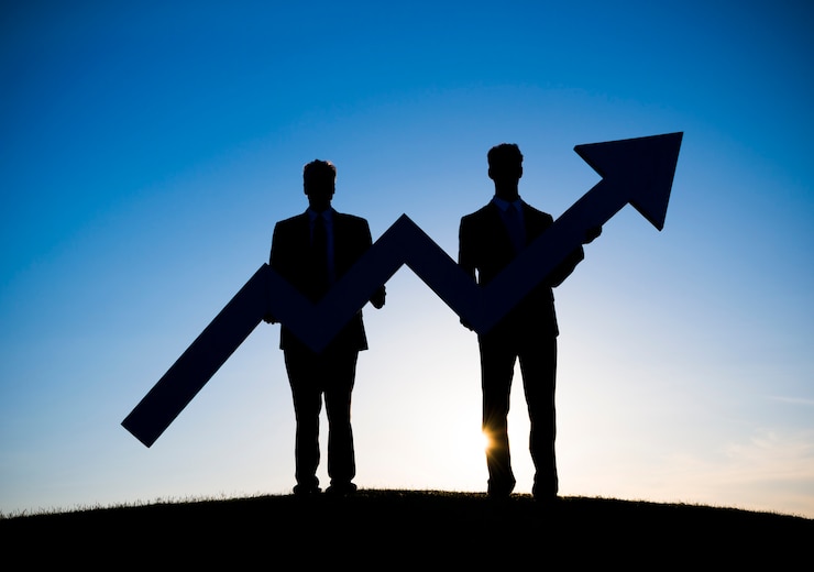 Photo two businessmen holding the increase graph on the hill