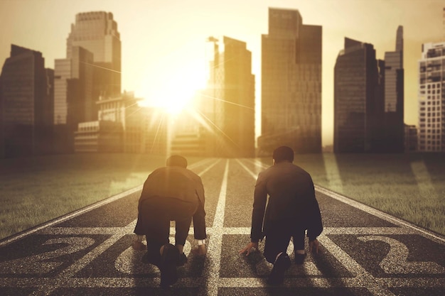 Two businessmen kneeling above 2022 numbers