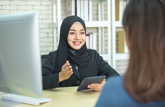 Two businesswoman muslim success meeting