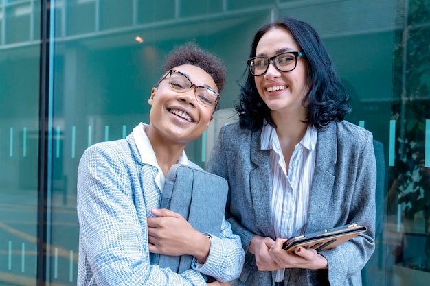 Two businesswoman with  tablet talking and smiling Joyful business partners concept