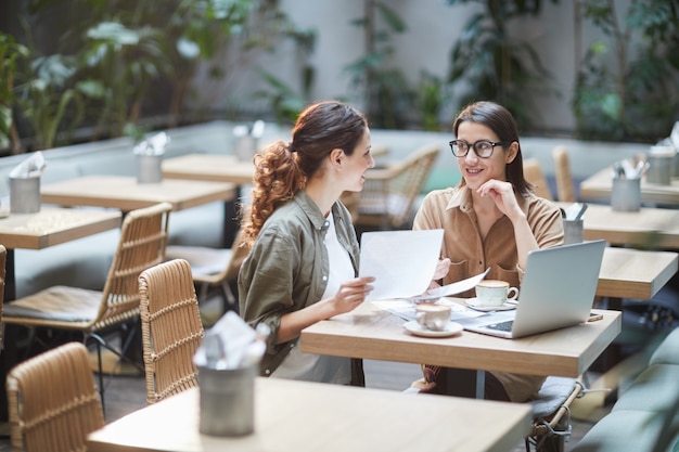 Two Businesswomen in Cafe