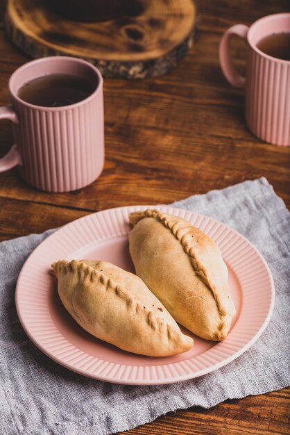 Two Cabbage Hand Pies on Plate