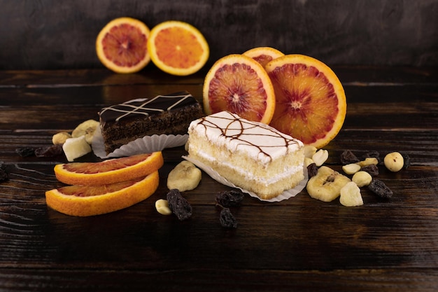 Photo two cakes with orange and dried fruit