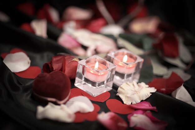 Two candles and a ring on a festive background