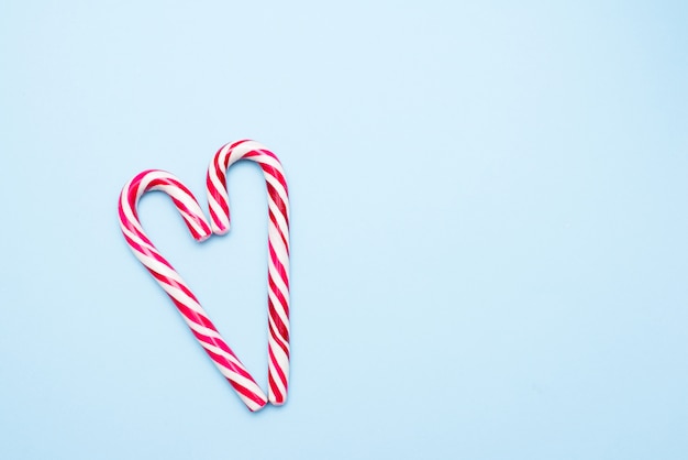 Two candy canes in heart shape