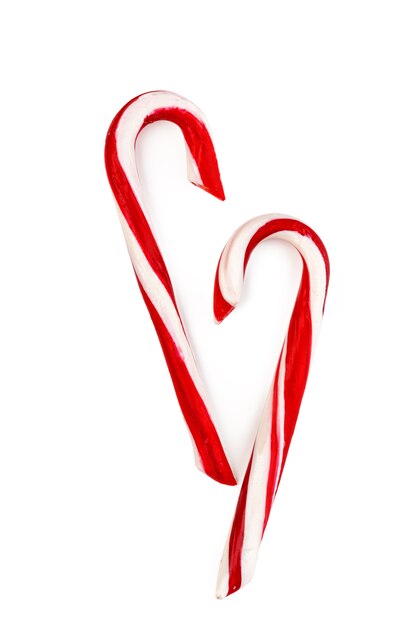 Two candy canes on white background