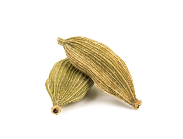 Two cardamom pods on white background