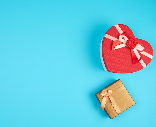 Two cardboard holiday boxes on blue 