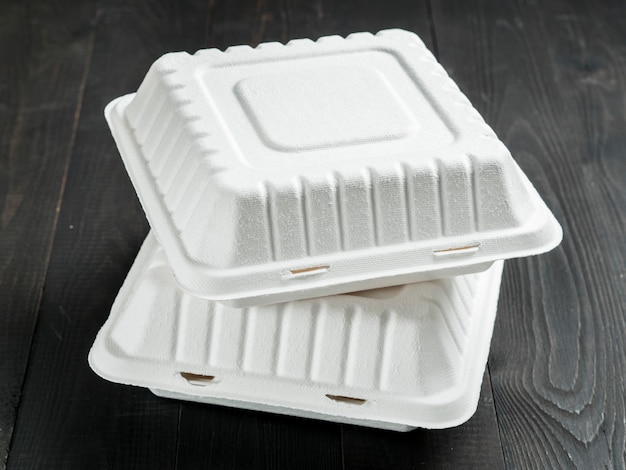 Two cardboard lunch box on wooden background