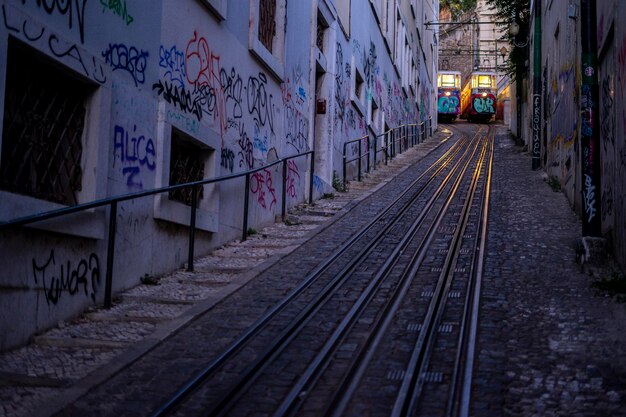 two carriages of the Lavra sidewalk elevator in the city of Lisbon at night