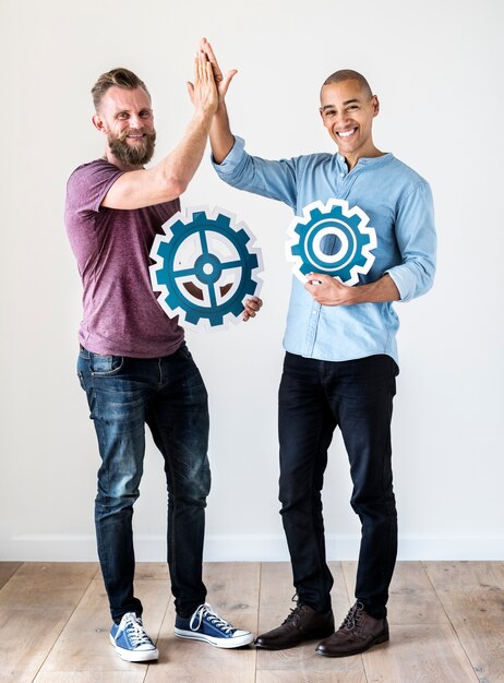 Photo two casual man holding cog icon