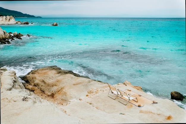 Two chairs on tropical beach