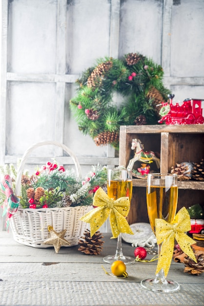 Two champagne glasses with christmas decoration