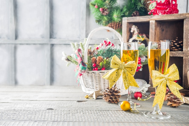 Two champagne glasses with christmas decoration