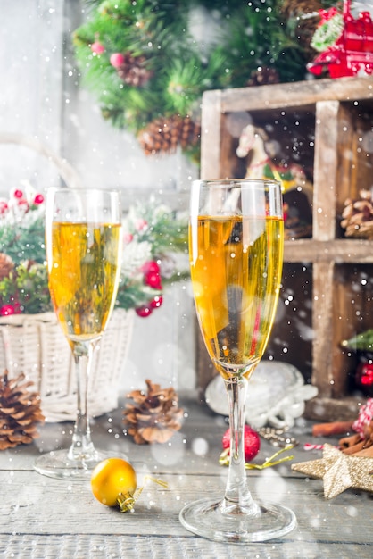 Two champagne glasses with christmas decoration