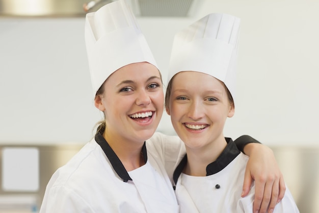 Two chefs smiling