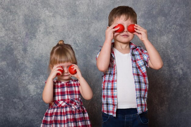 Two children a girl and a boy dressed in checkered clothes