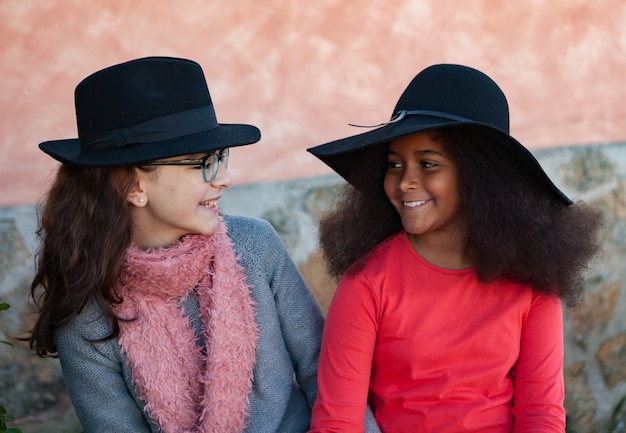 Two children with stylish hats