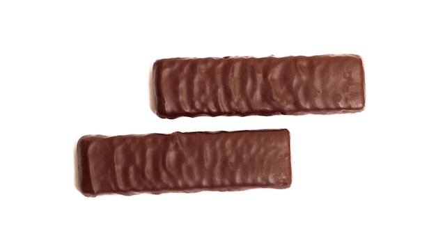 Две шоколадные конфеты на белом фоне