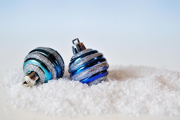 Two Christmas balls on abstract background