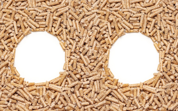 Two circle frames made with alternative biofuel from sawdust wood pellets