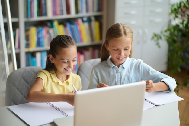 Two classmates studying at a public library