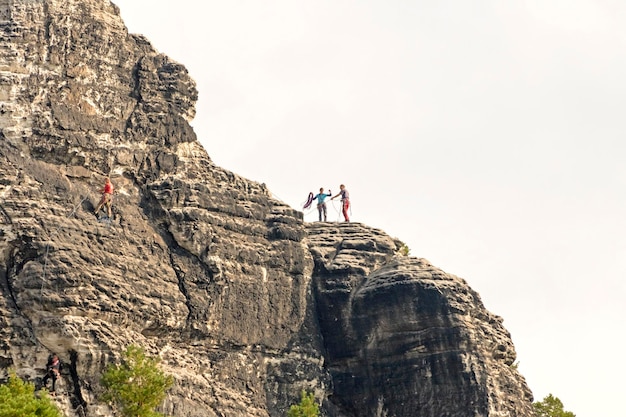 Two climber on a mountain top against the sky