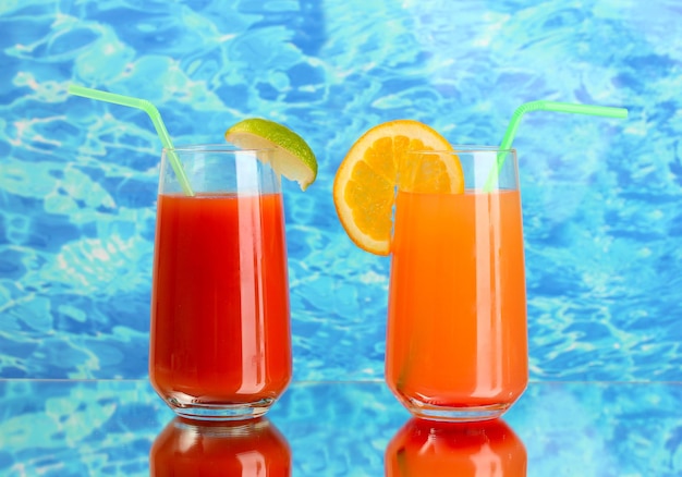 Two cocktails on blue background