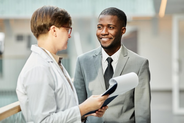 Two Colleagues in Office Building