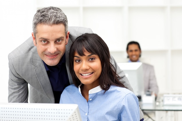 Two colleagues working together at a computer 