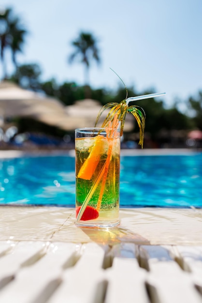 Two Colorful Tropical Cocktails near the Swimming Pool