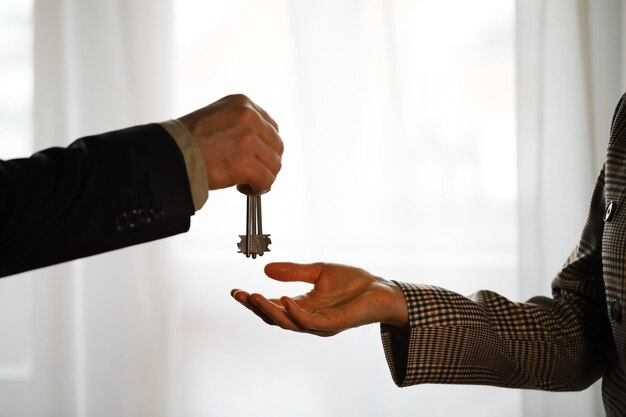 Two confident business man shaking hands during a meeting in the office success dealing greeting and partner concept