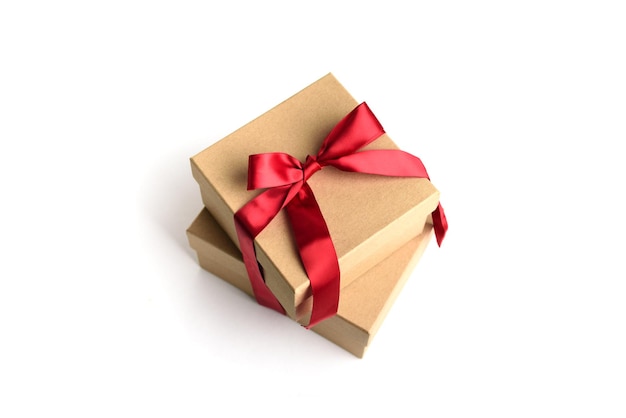 Two craft gift boxes with red ribbon bow