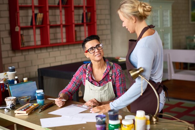 Two Creative Artists Working in Studio