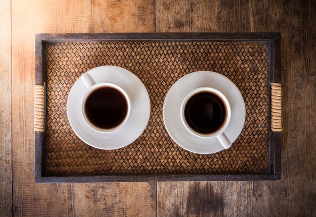 Two Cup of coffee on a wooden table