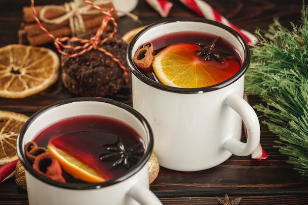 Two cups of christmas mulled wine on a wooden table