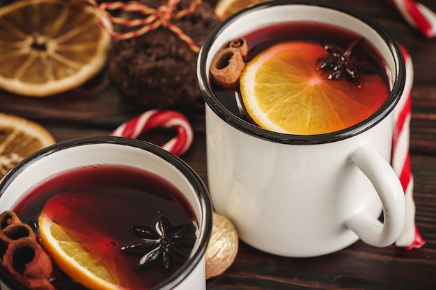 Two cups of christmas mulled wine on a wooden table