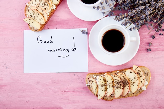 Two cups of coffee  with bouquet of flowers lavender