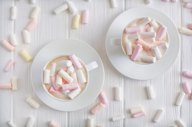 Two cups of morning cappuccino with marshmallows