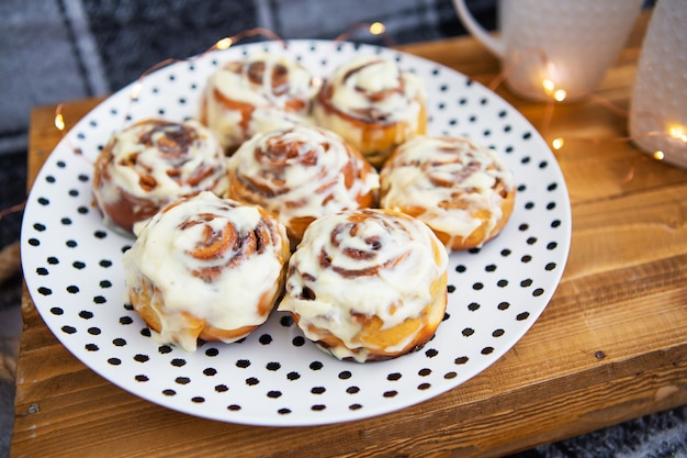 Two cups of tea and cinnamon rolls