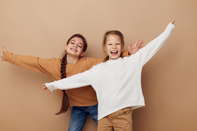 two cute little girls hug friendship childhood posing. High quality photo