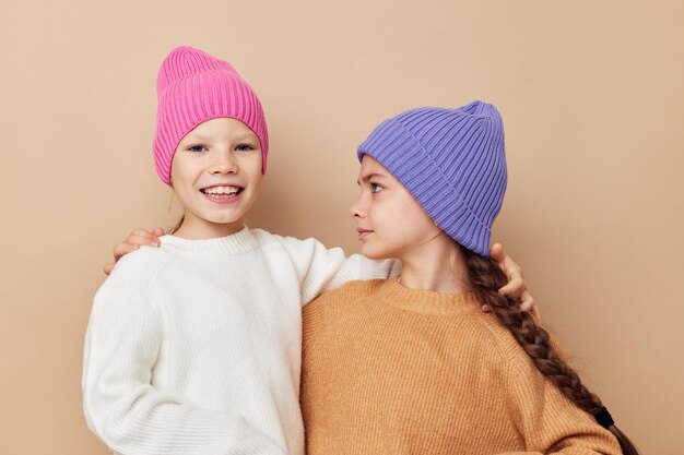 Two cute little girls wearing hats fashion childhood