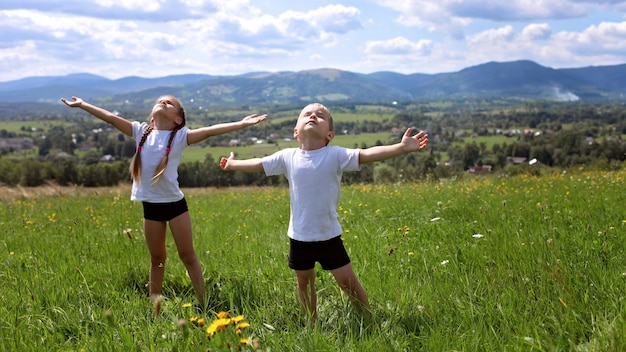 Two cute sibling doing their morning exercises