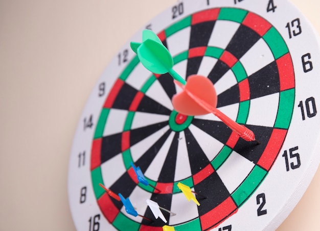 Two dart on the dart board on the wall